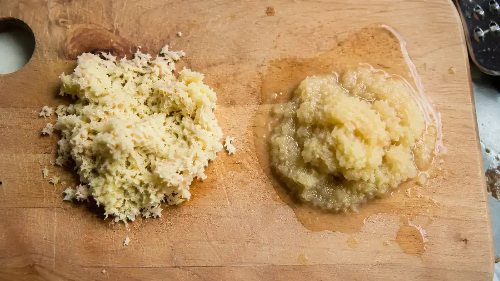 Side-by-side comparison of dry pulp from the Jocuu juicer next to visibly wetter pulp from the Ninja cold press